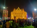 A large number of people celebrate the Durga Puja festival at a Durga Puja pandal West Bengal, India. Bengali durga puja.