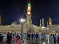 Pilgrims gather at night in the outer courtyard of Masjid Al Nabawi, Madinah.