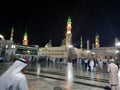 Pilgrims gather at night in the outer courtyard of Masjid Al Nabawi, Madinah.