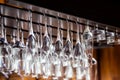 a large number of shiny glasses hanging from the ceiling in the cocktail bar Royalty Free Stock Photo