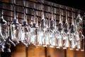 A large number of shiny glasses hanging from the ceiling in the cocktail bar Royalty Free Stock Photo