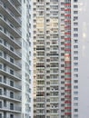 A large number of windows and balconies on building facade. Apartment block. Residential building. Precast apartment building,