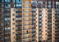 A large number of windows and balconies on building facade. Apartment block. Residential building Royalty Free Stock Photo