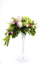 A large number of yety, a large lush bouquet of snowdrop, rose, bell and peony with greens in a large long stylish