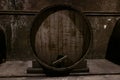 Large oak barrel with wine close-up. It stands in an old dark cellar Royalty Free Stock Photo