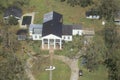 Large oak trees are ripped up from their roots and rooftops are torn from houses after the passage of Hurricane Andrew through