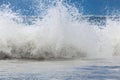 Large ocean waves with white foam. The raging ocean storm.