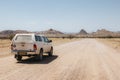 Large offroad vehicle parked on the side of the road on the way to Twyfelfontein, Namibia