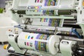 Large offset printing press or magazine running a long roll off paper in production line of industrial printer machine Royalty Free Stock Photo