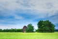 A large old barn in a green field Royalty Free Stock Photo