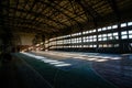 Large old ruined gymnasium in abandoned school