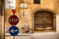 Large old timber gate and a bicycle chained to a street sign