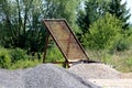 Large old vintage rusted gravel sand sieve screen mesh held together with strong metal frame left at abandoned construction site