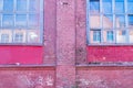 Large old windows, in a brick red building Royalty Free Stock Photo