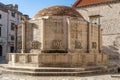 Large Onofrio's Fountain with carved masks in old town Dubrovnik street stradun in Croatia summer morning Royalty Free Stock Photo