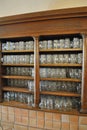 Large open decorative cabinet with wooden shelves for storing beer mugs stands in a beer restaurant