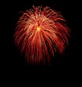 Large orange bursting firework with yellow center Royalty Free Stock Photo