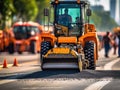 Large orange construction vehicle is working on an asphalt road. The machine has been digging up and flattening out Royalty Free Stock Photo