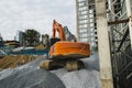 Large orange excavator working on a gravel on construction site. Details of industrial excavator. Big excavator standing Royalty Free Stock Photo