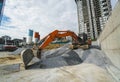 Large orange excavator working on a gravel on construction site. Details of industrial excavator. Big excavator standing Royalty Free Stock Photo