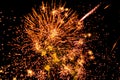 Large orange firework with fiery trails in the sky Royalty Free Stock Photo