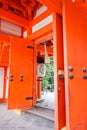 Large orange wooden door open with decorative large Japanese white lantern at the main gate of Heian Shrine Royalty Free Stock Photo