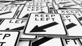 Large ordered pile of black and white keep left traffic signs Royalty Free Stock Photo