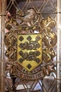 Large ornate family crest in doorway of home, 1890 House Museum, Cortland, New York, 2018