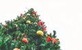 Large outdoor Christmas tree against a white sky view from below