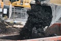 A digger and dump truck move dirt to make room for the foundations Royalty Free Stock Photo