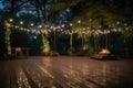 large outdoor dance floor surrounded by twinkling lights and towering trees