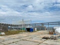 A large outdoor warehouse at a construction site, a warehouse for industrial equipment and materials in boxes at an open-air Royalty Free Stock Photo