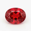A large oval cut red gemstone on a white background Royalty Free Stock Photo