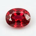 A large oval cut red gemstone on a white background Royalty Free Stock Photo