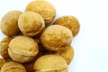 Large oval whole walnuts on white background Royalty Free Stock Photo