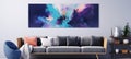 A large painting hangs on the wall above a couch in a living room Royalty Free Stock Photo