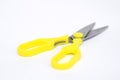 A large pair of scissors with yellow handles Royalty Free Stock Photo