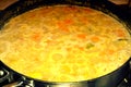 Large pan of boiling vegetable soup