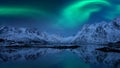 Northern lights, Aurora borealis, Lofoten islands, Norway. Night winter landscape with polar lights, starry sky and mountains Royalty Free Stock Photo