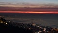 Large panoramic view  of lebanese shore of Kaslik and Jounieh and beirut in a far end by night with the red light of dusk Royalty Free Stock Photo