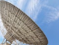 Large satellite antenna soaring into sky Royalty Free Stock Photo