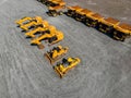Large parking lot with big yellow mining truck, bulldozers for coal industry, ore and gold. Concept sale of industrial Royalty Free Stock Photo