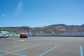 Large parking lot with a few cars in a city in Spain Royalty Free Stock Photo