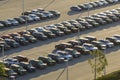 Large parking lot of local dealer with many brand new cars parked for sale. Development of american automotive industry Royalty Free Stock Photo