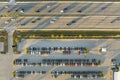 Large parking lot of local dealer with many brand new cars parked for sale on highway roadside. Development of american Royalty Free Stock Photo