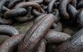 Large partially rusted eyes of huge ship chain