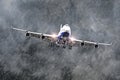 Large passenger airplane approaches the landing at the airport of rain, bad weather. Royalty Free Stock Photo