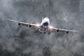 Large passenger airplane approaches the landing at the airport of rain, bad weather.