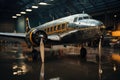 A large passenger airplane stands in an airport hangar