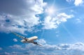 Large passenger plane in blue sky